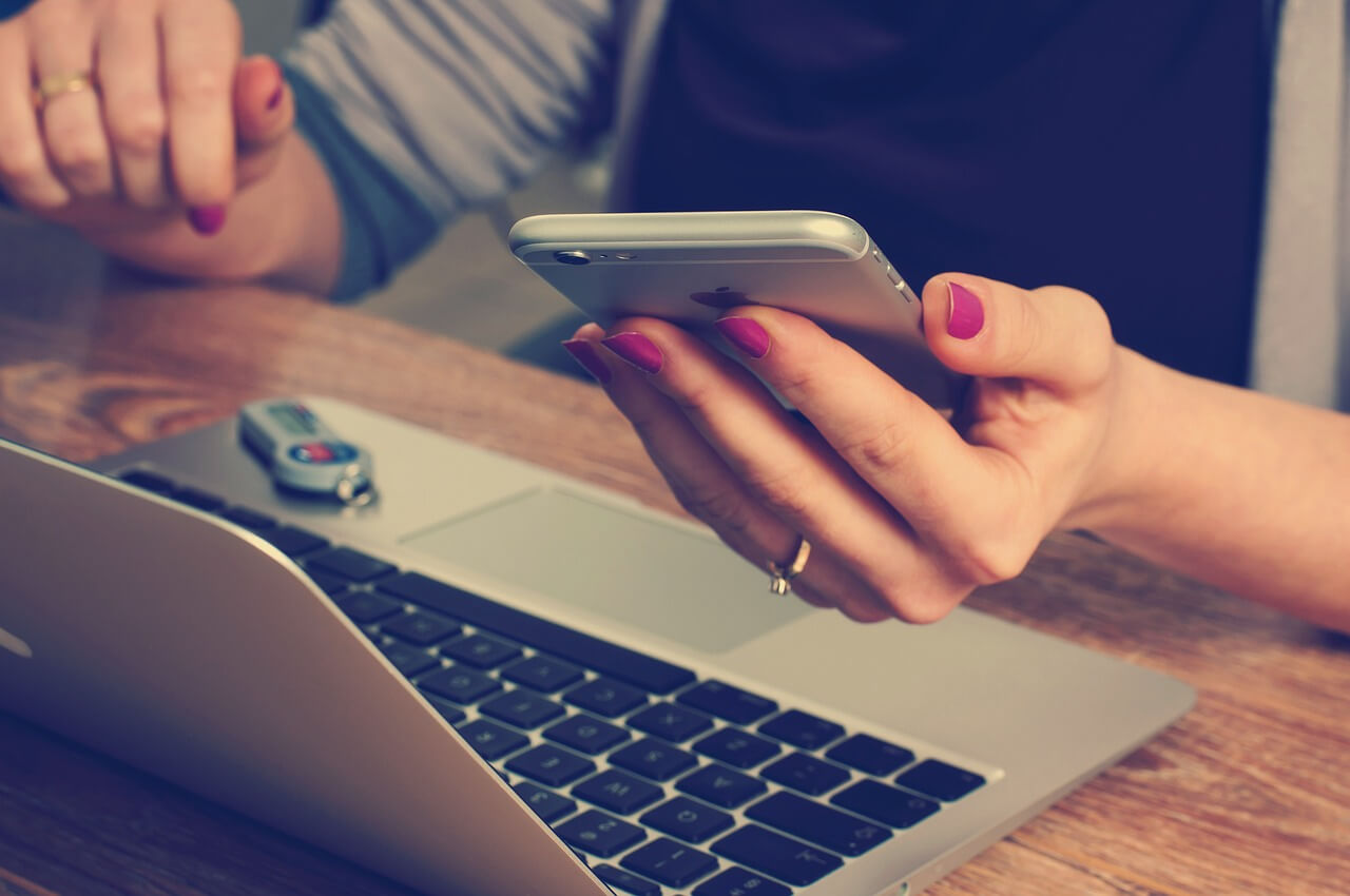 woman-on-laptop-and-calculator-image-with-text--great-dog-wholesale-inquiries